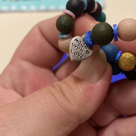 Set of 2 bracelets with wooden beads &clay, spacers,&charm 6 1/2 in water proof - Picture 3 of 4